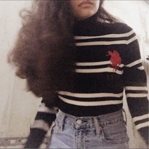 a white and black striped USPA sweater